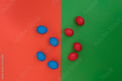 Colored eggs on a bright background. Top view with copy space.