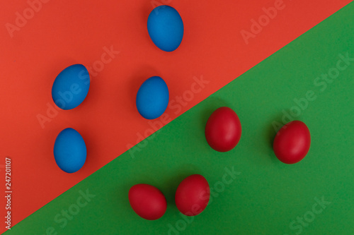Colored eggs on a bright background. Top view with copy space.