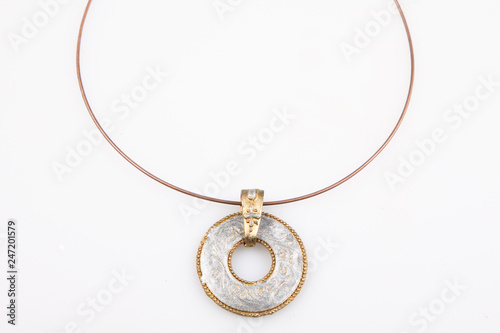 round jewerly necklace from south america in white background