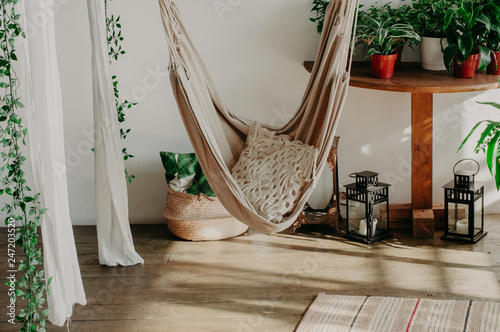 hammock in the minimalism bedroom interior. Pillows, plant
