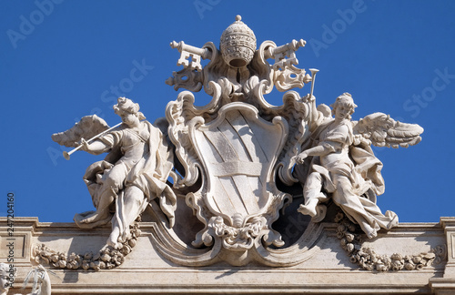 Canvas Print Coat-of-arms of Pope Clement XII on the Trevi Fountain in Rome