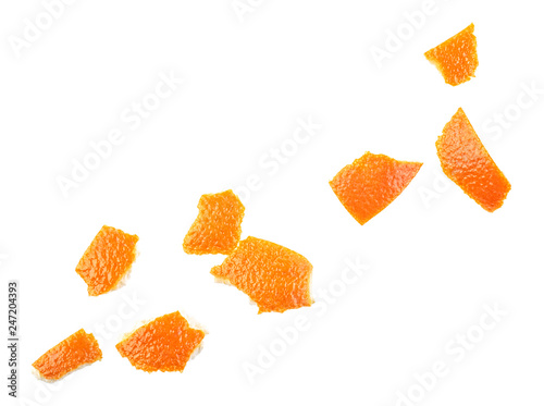 Different parts of orange peel isolated on white background, top view.