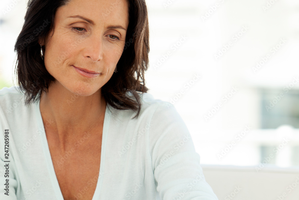 Thoughtful middle age woman - close up portrait Thoughtful middle age woman - close up portrait