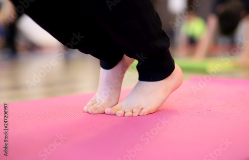 boy in yoga position feet