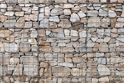 Retaining wall gabion baskets, Gabion wall caged stones textured background photo