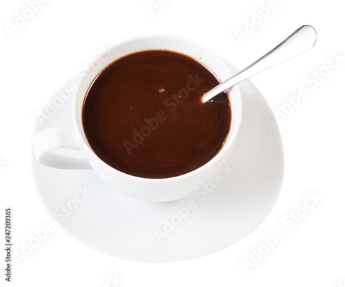 carob powder drink in white cup with spoon