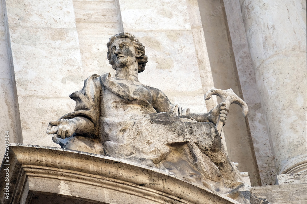 Angel on facade of San Marcello al Corso church in Rome, Italy 
