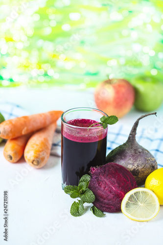 fresh juice from homemade vegetables. Beet smoothie. Detox, vegetarianism On a bright summer background