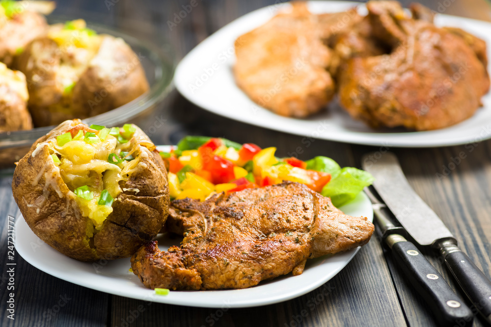 roasted pork chop and potatoes with stuffed skin roasted pork chop and potatoes with stuffed skin