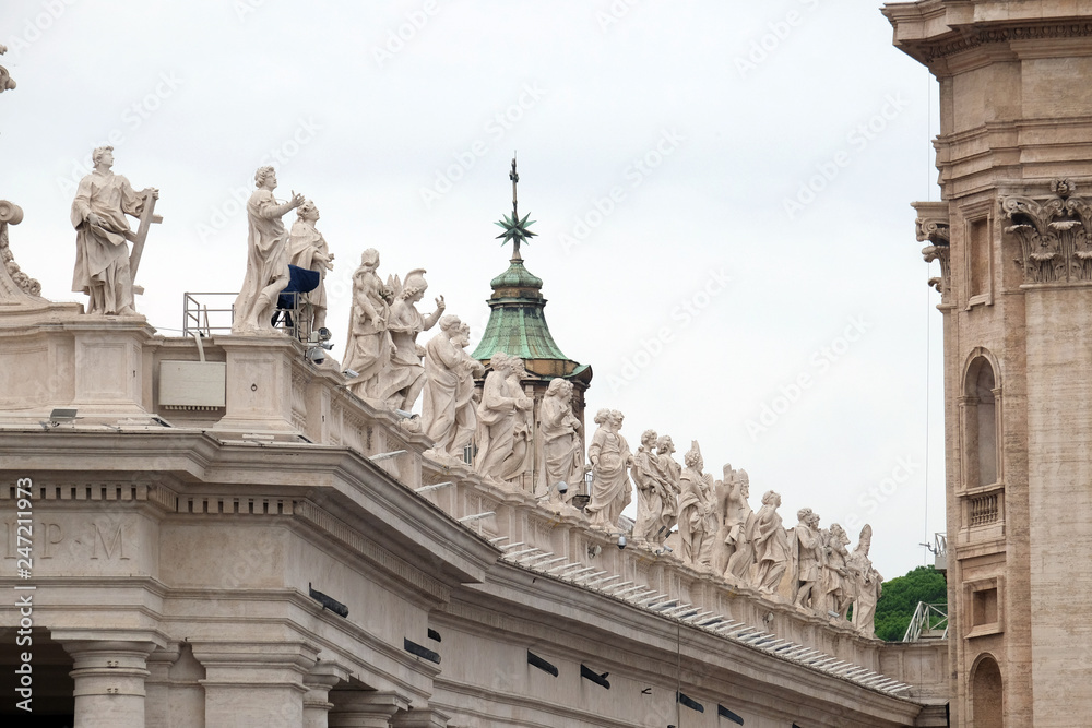 Gallery of saints, fragment of colonnade of St. Peters Basilica. Papal Basilica of St. Peter in Vatican - the world largest church, is the center of Christianity in Rome, Italy 