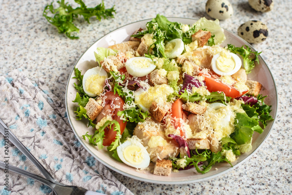 Fresh caesar salad with chicken breast, lettuce and tomatoes. Delicious spring salad Fresh caesar salad with chicken breast, lettuce and tomatoes. Delicious spring salad