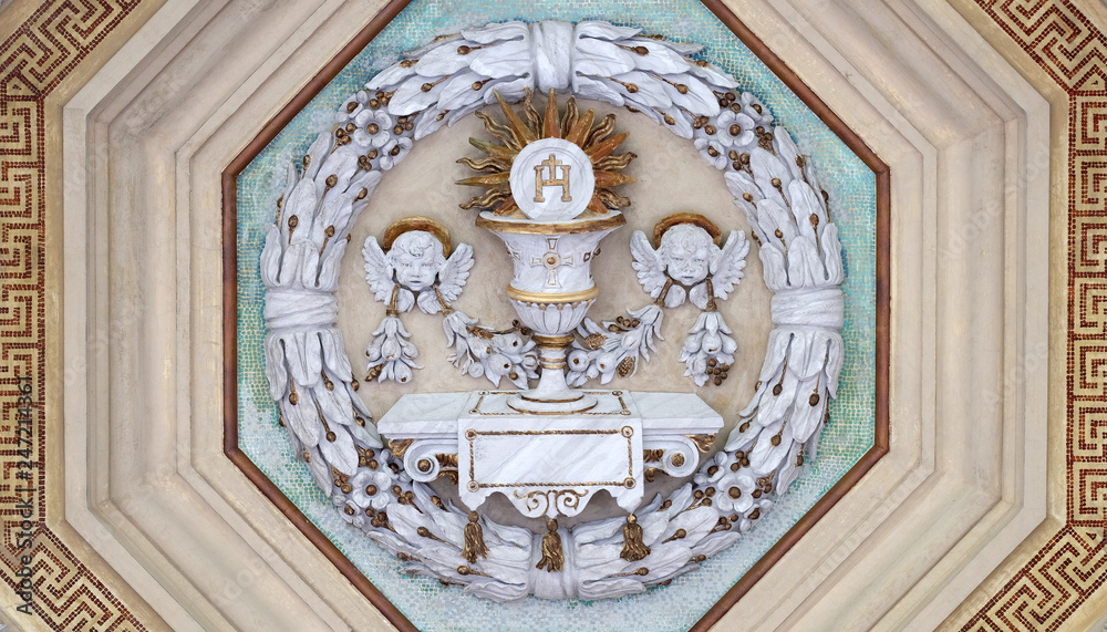 Obraz premium Eucharist chalice and wafer, stucco decoration, basilica of Saint Paul Outside the Walls, Rome, Italy 