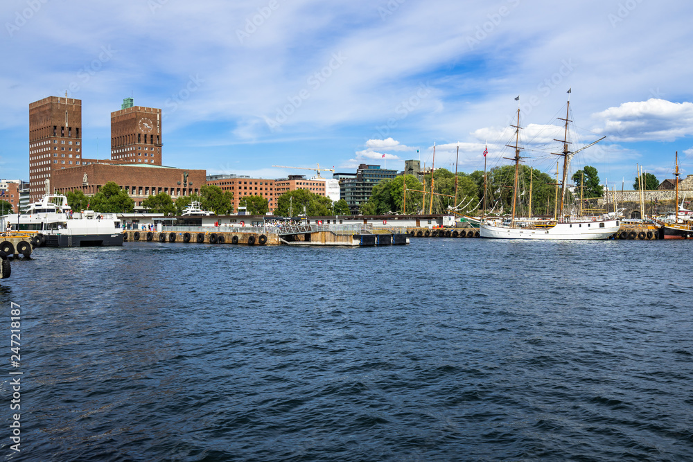 Wide panorama of Oslo harbour with Oslo City Hall (Radhus) and Akershus fortress, Norway