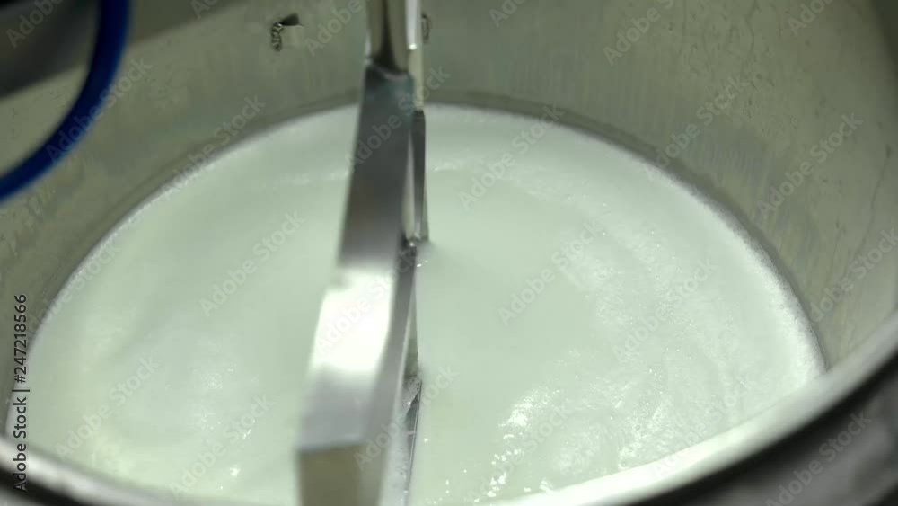 Sour cream and yoghurt production. Pasteurization of milk in metal container. Process of making