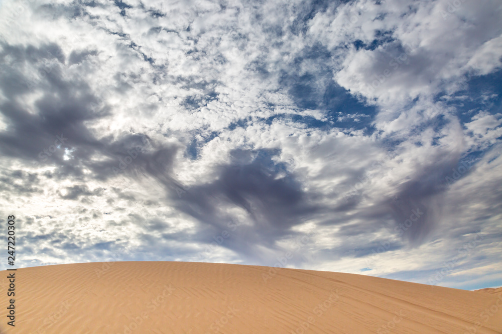 Dramatic clouds above the Imperial Sand Dunes in California