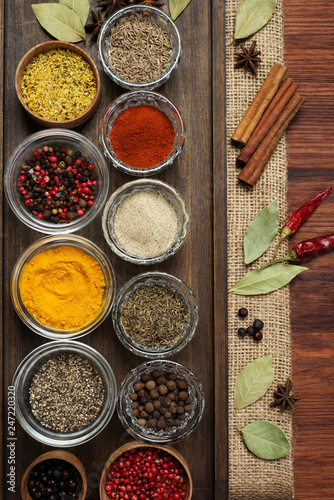 Spices and seasonings on the brown wooden board