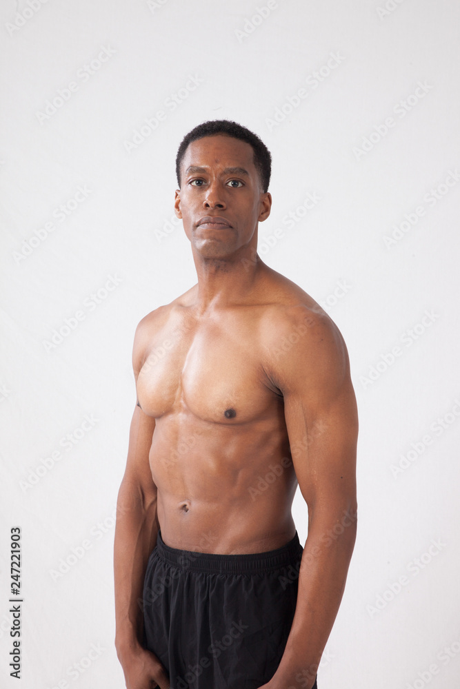Strong Black man flexing muscles