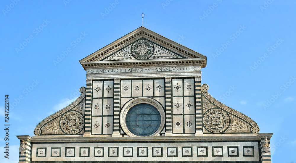 Top of the Santa Maria Novella church (13th century). It contains art treasures, funerary monuments, famous Gothic and early Renaissance frescoes. Basilica. Close up. Italy, Florence.