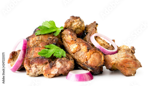 Photos Heap of shashlik with parsley leaves and onion close up on a white
