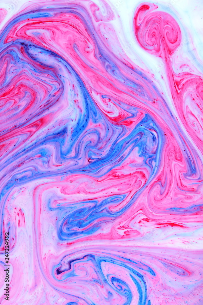 Abstract multicolored background. Fluid art with pink blue color. Blue pink texture. Colored paint stains in liquid