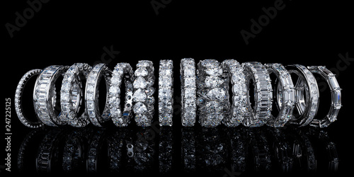 Multiple diamond eternity rings on black background