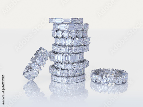 Stacked diamond eternity rings on white background photo