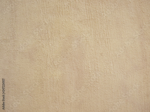 White stipple effect wall in vanilla color texture background