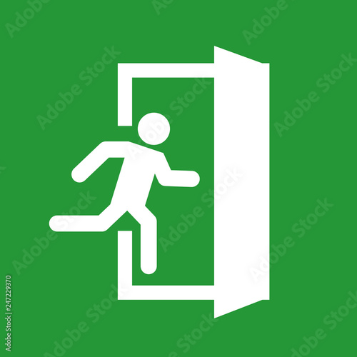 Green emergency exit sign on white