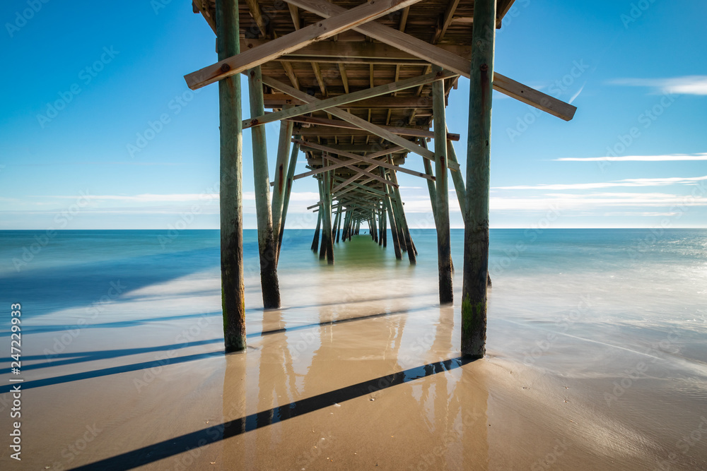 Fototapeta premium Long Exposure under Pier in Atlantic Beach, North Carolina Damaged by Hurricane Florence