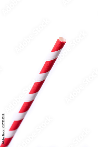 Real paper straws with a red and white spiral design. Perfect for the concept of sustainability. Recyclable, reusable material. Eco friendly, bio,  save nature concepts. Very close-up. Front, top view
