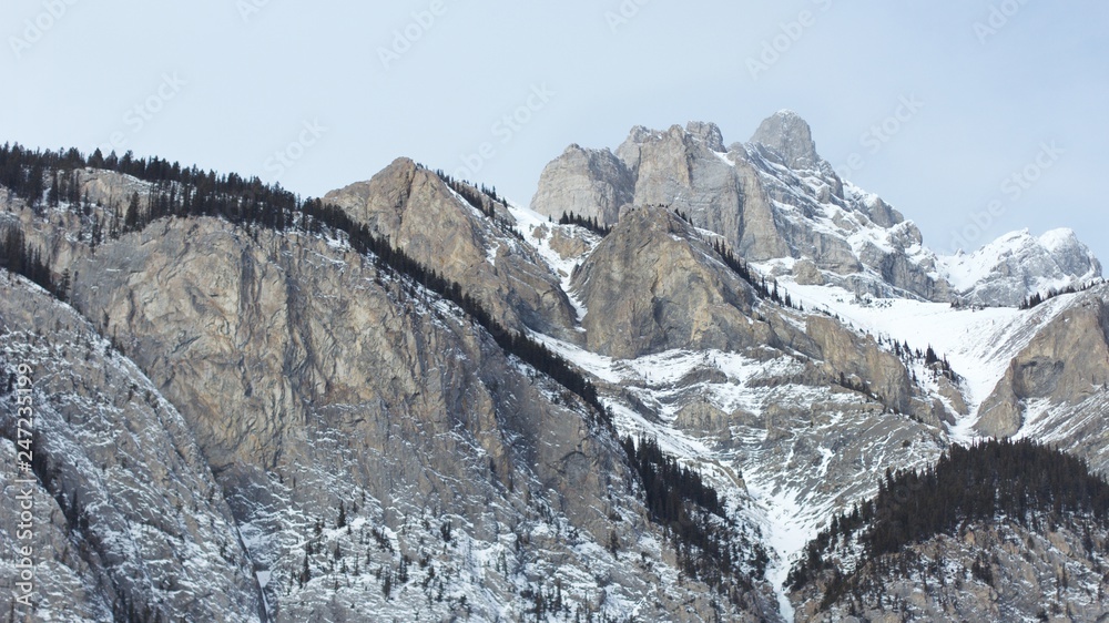 Rugged snow covered mountains from below Rugged snow covered mountains from below