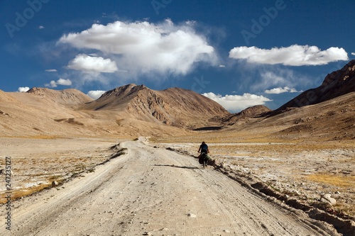 Pamir highway or Pamirskij trakt with biker, Tajikistan