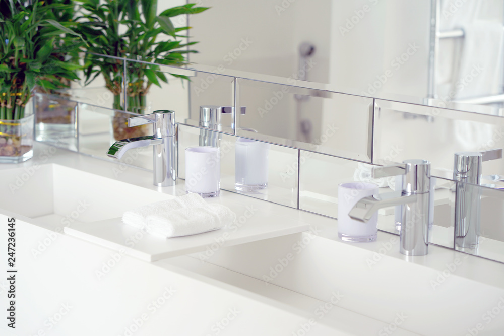 Bathroom interior sink with modern design. Interior of bathroom with washbasin and faucet Bathroom interior sink with modern design. Interior of bathroom with washbasin and faucet