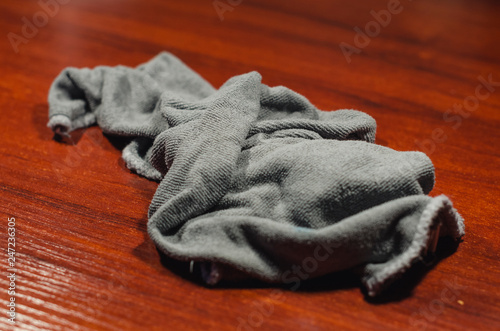 Fototapeta Naklejka Na Ścianę i Meble -  Grey rag on the wooden desk