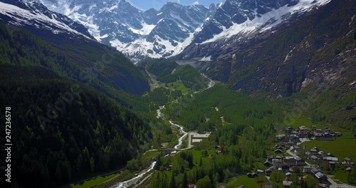 Aerial shot of Mount Rosa and its glaciers in the Italian Alps and its village