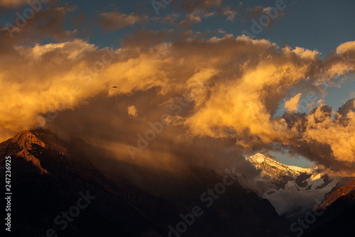 Landscape with Machapuchare-Fishtail peak at sunset view from Ghandruk during trekking in Himalaya Mountains, Nepal