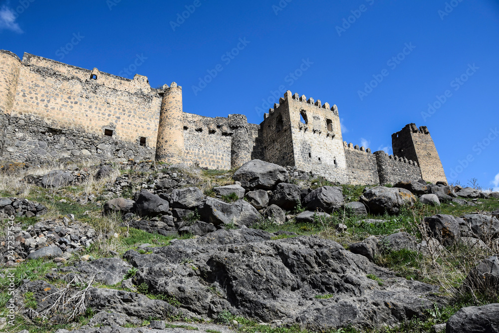 ancient antique castle stands high in the mountains