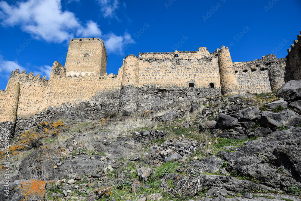 ancient antique castle stands high in the mountains