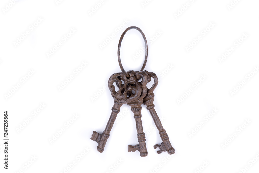 Bunch of old keys on white background. Old key laying on the background. Top view. Close up. Bunch of old keys on white background. Old key laying on the background. Top view. Close up.