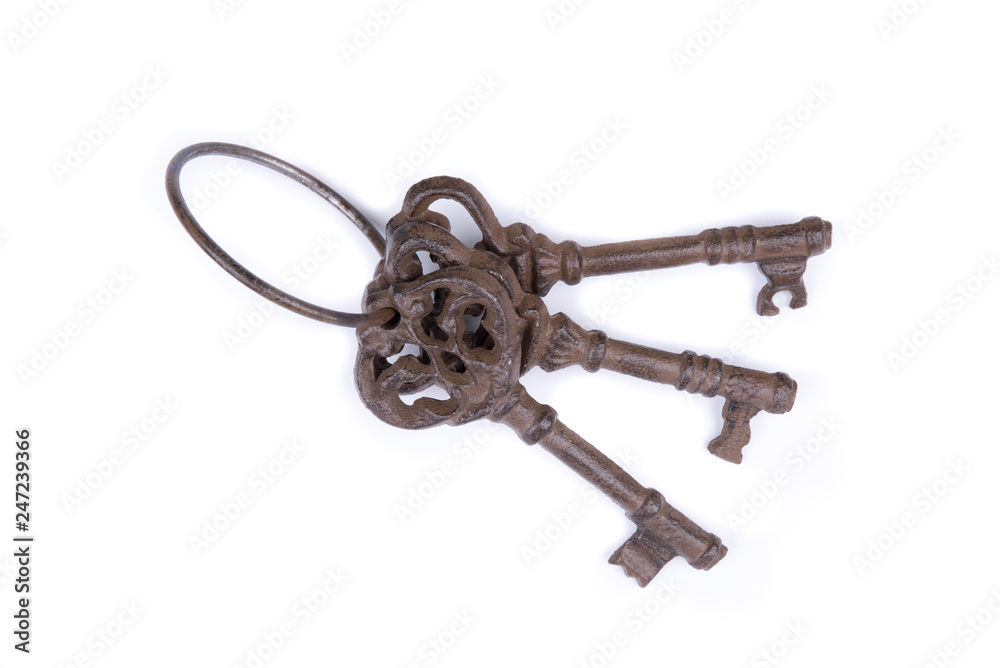 Bunch of old keys on white background. Old key laying on the background. Top view. Close up. Bunch of old keys on white background. Old key laying on the background. Top view. Close up.