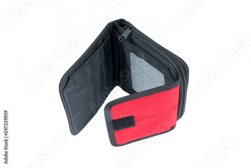 Open wallet in red and black on a white background. Empty purse with no money. Minimalism design. Wallet for shopping. No pocket money. Top view.