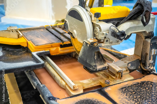 Wallpaper Mural Circular saw with water supply. Saw the stone. Circular saw for construction work. Torontodigital.ca