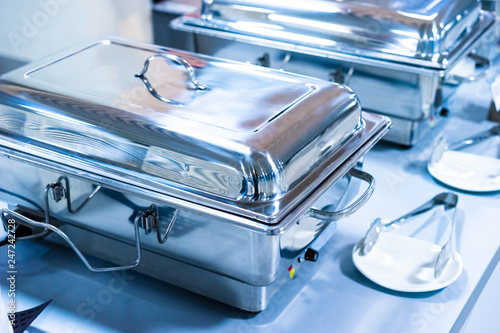 Chafing Dishes. Catering food. chafing dishes in line. Dishes for the restaurant. Heated Buffet Containers. photo