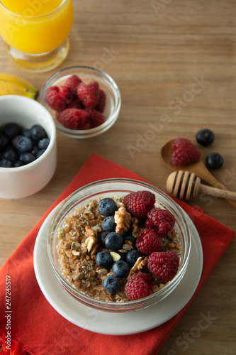 Cereal, muesli and various delicious fruit, berries for breakfast. healthy, energy breakfast, wooden table.