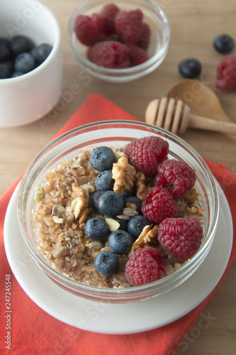 Cereal, muesli and various delicious fruit, berries for breakfast. healthy, energy breakfast, wooden table.