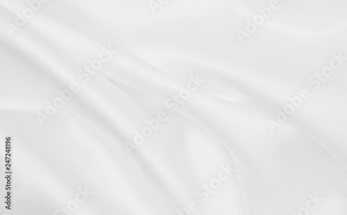 Smooth elegant white silk or satin luxury cloth texture as wedding background. Luxurious background design