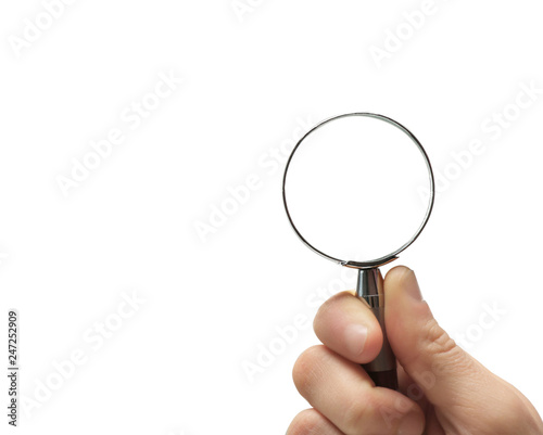 Woman holding magnifying glass on white background, closeup. Space for text