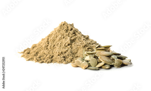 Pile of fresh flour and pumpkin seeds isolated on white photo