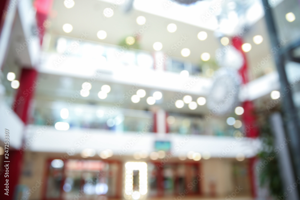 Blurred view of shopping mall entrance hall interior Blurred view of shopping mall entrance hall interior