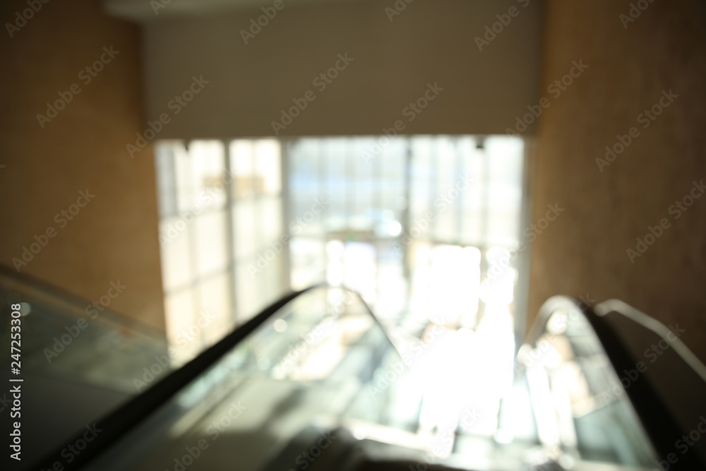 Blurred view of modern escalator in shopping mall Blurred view of modern escalator in shopping mall